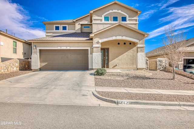 view of front of home with a garage, fence, driveway, roof with shingles, and stucco siding