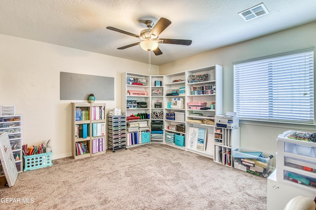 game room with visible vents, ceiling fan, a textured ceiling, and carpet flooring