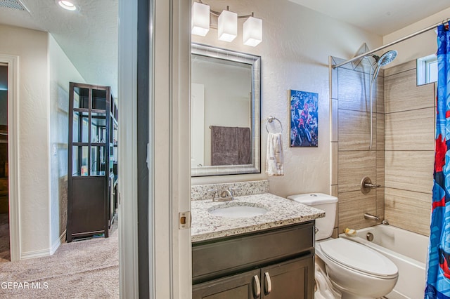 bathroom featuring visible vents, a textured wall, toilet, shower / tub combo with curtain, and vanity