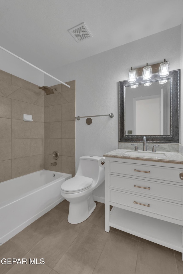 full bath featuring shower / bathtub combination, toilet, vanity, visible vents, and tile patterned floors