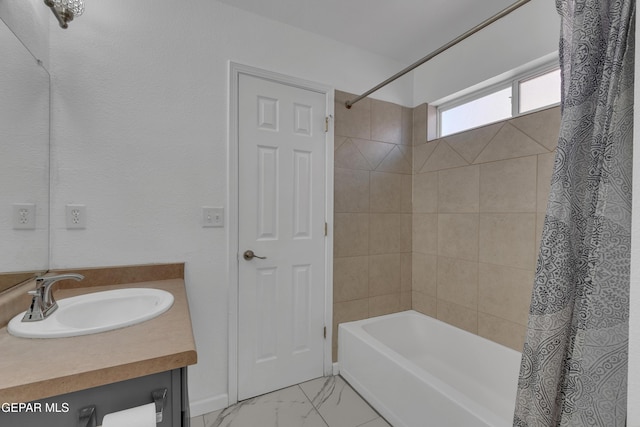 full bath featuring marble finish floor, vanity, and shower / bathtub combination with curtain