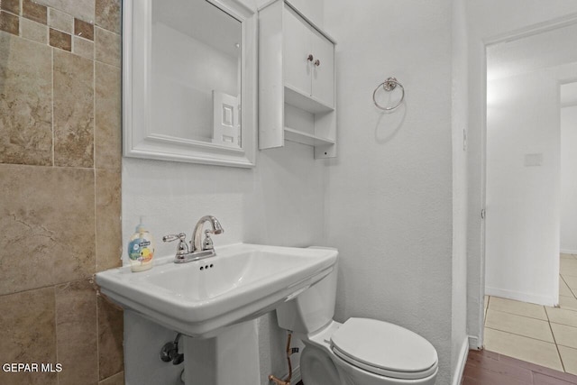 bathroom with a sink and toilet