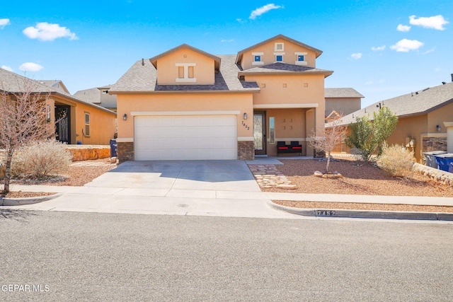 view of front of home featuring stone siding, roof with shingles, concrete driveway, and stucco siding