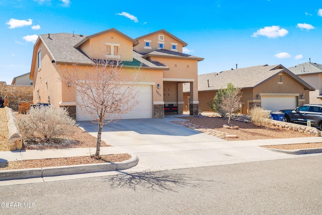 view of front facade with a garage, stone siding, concrete driveway, and stucco siding