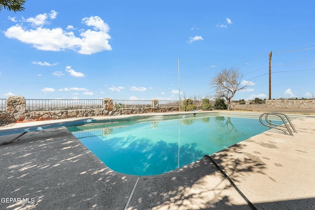 view of pool featuring a patio, fence, and a fenced in pool