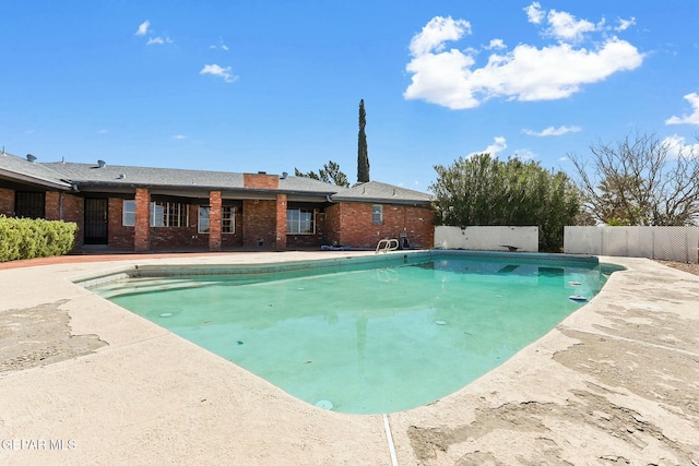 view of pool with a patio, fence, and a fenced in pool