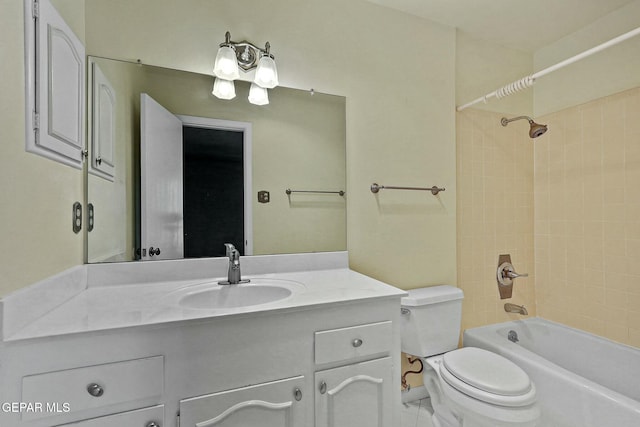 full bathroom featuring tub / shower combination, vanity, and toilet