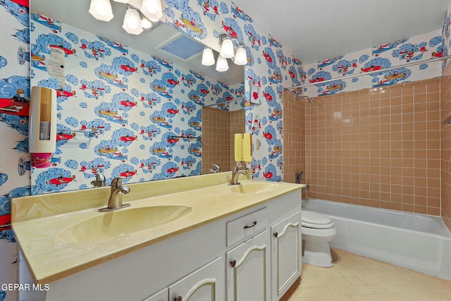 full bathroom with tile patterned floors, double vanity, a sink, and wallpapered walls