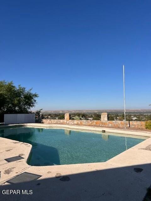 outdoor pool featuring a patio