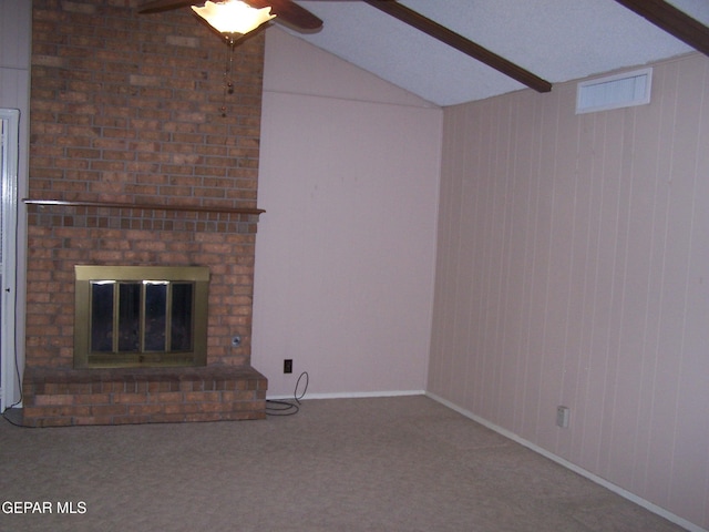 unfurnished living room featuring visible vents, a ceiling fan, carpet, a brick fireplace, and vaulted ceiling with beams