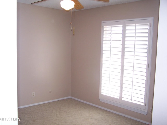 spare room with baseboards