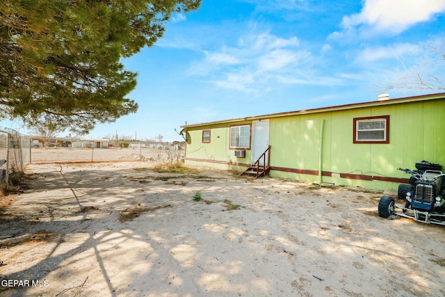 160 Indian Head Rd, Tornillo, TX 79853 - back of property with entry steps, fence, and cooling unit