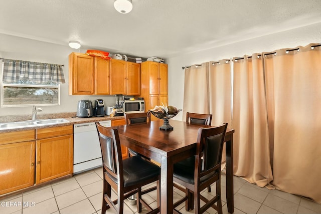 160 Indian Head Rd, Tornillo, TX 79853 - kitchen featuring white appliances, light countertops, a sink, and light tile patterned flooring
