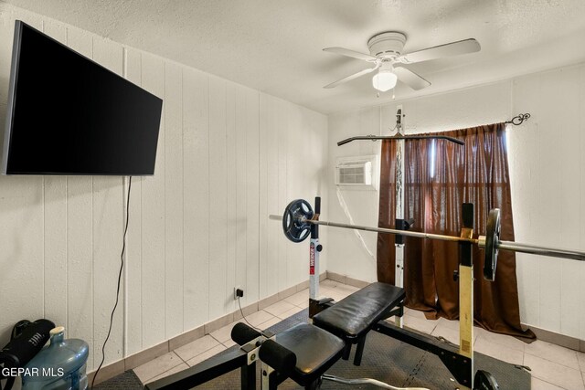 160 Indian Head Rd, Tornillo, TX 79853 - workout room featuring tile patterned flooring, ceiling fan, a textured ceiling, and a wall mounted AC