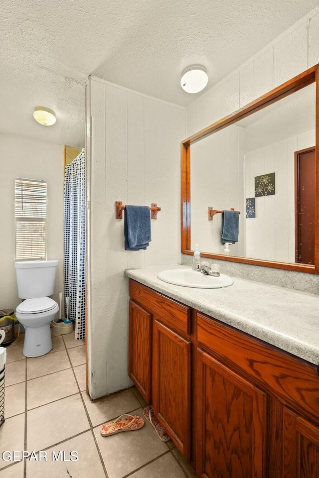 160 Indian Head Rd, Tornillo, TX 79853 - bathroom featuring toilet, tile patterned floors, a textured ceiling, and vanity