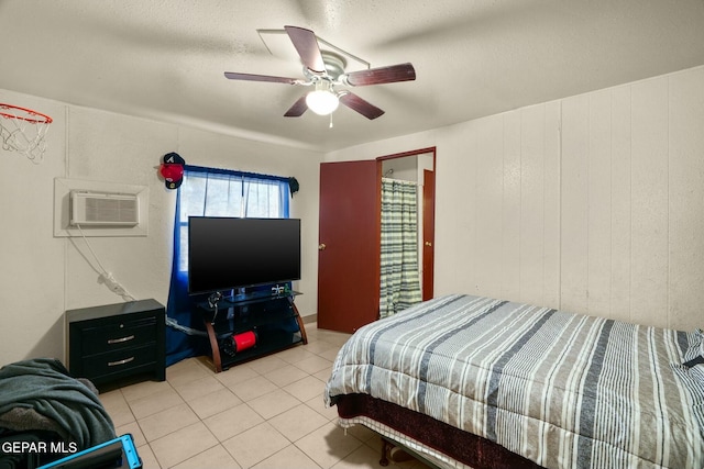 160 Indian Head Rd, Tornillo, TX 79853 - bedroom with a wall unit AC, light tile patterned floors, and ceiling fan