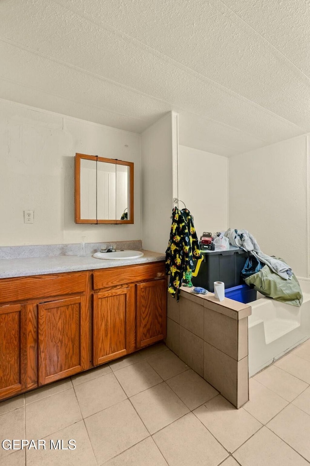 160 Indian Head Rd, Tornillo, TX 79853 - bathroom with a textured ceiling, vanity, and tile patterned floors