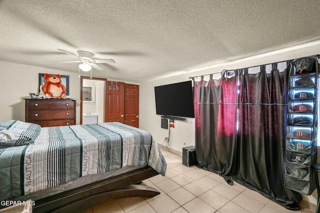160 Indian Head Rd, Tornillo, TX 79853 - bedroom featuring a ceiling fan, connected bathroom, a textured ceiling, and light tile patterned floors