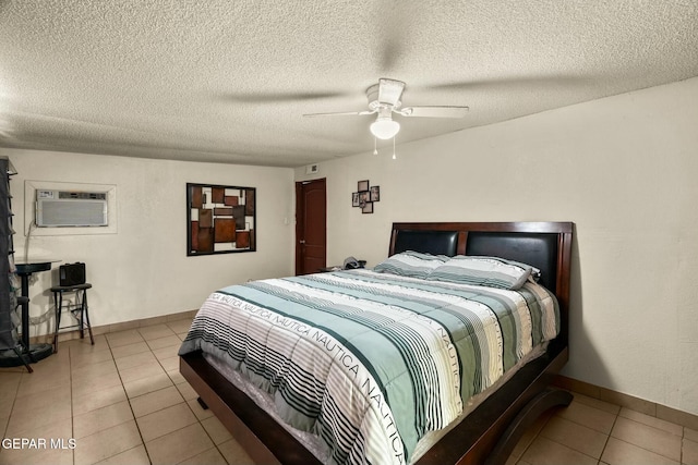160 Indian Head Rd, Tornillo, TX 79853 - tiled bedroom featuring a wall unit AC, ceiling fan, a textured ceiling, and baseboards