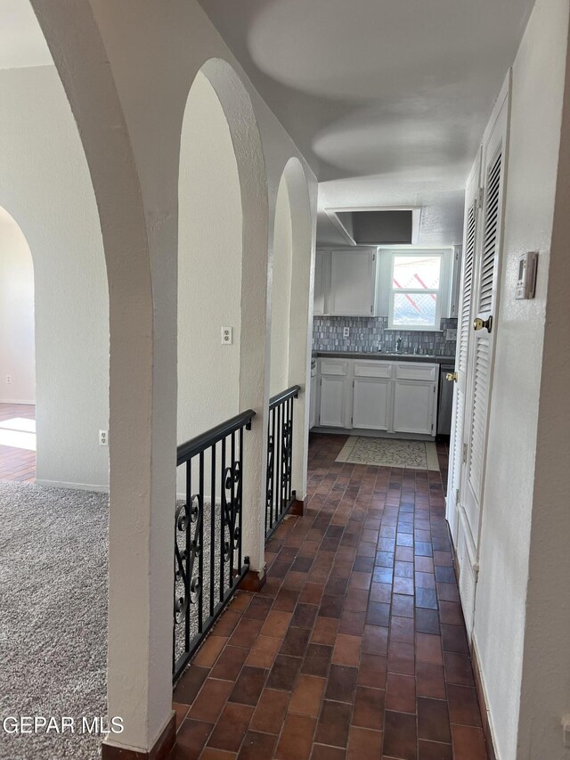 corridor featuring a textured wall