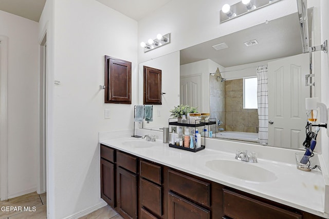 full bathroom with double vanity, shower / washtub combination, a sink, and visible vents