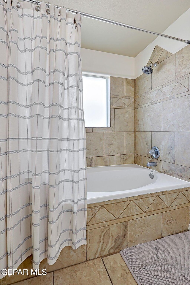 full bathroom with tiled shower / bath