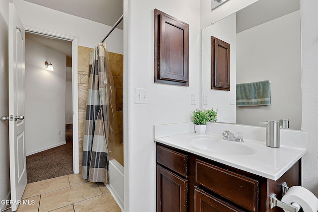 bathroom with shower / tub combo, tile patterned flooring, and vanity