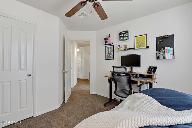 carpeted bedroom with baseboards, visible vents, and a ceiling fan