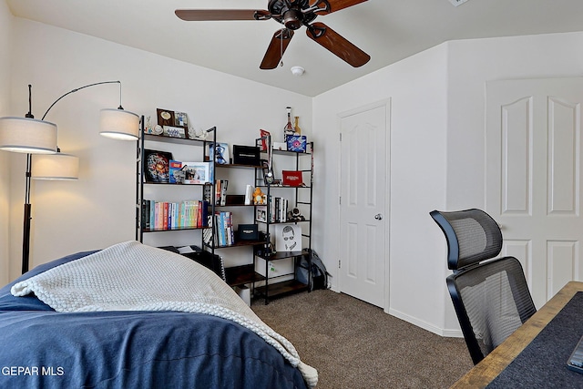 bedroom with ceiling fan, carpet floors, and baseboards