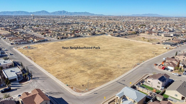 drone / aerial view with a residential view and a mountain view