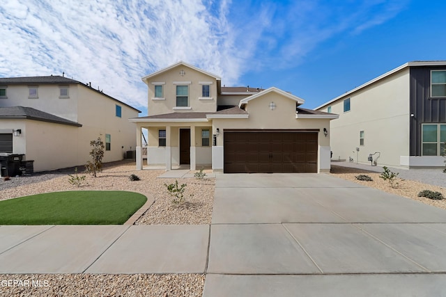 1653 Tony Harper St, El Paso, TX 79928 - view of front of house with stucco siding, driveway, and covered porch