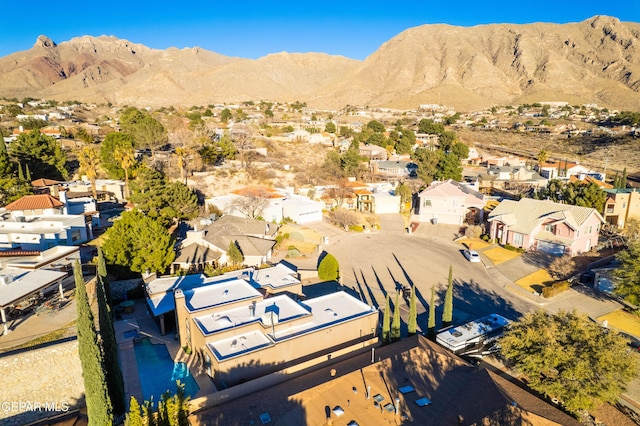 drone / aerial view featuring a residential view and a mountain view