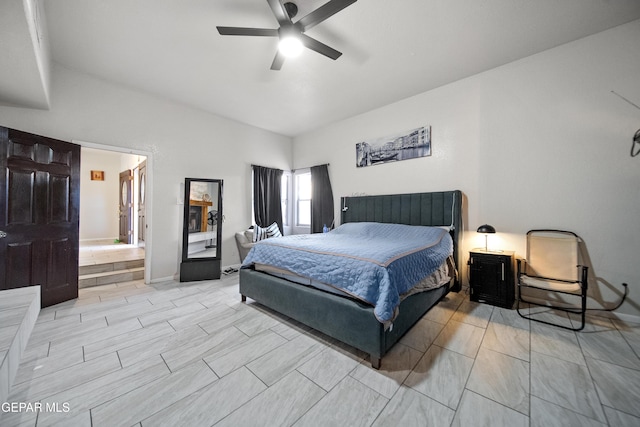 bedroom with ceiling fan and baseboards