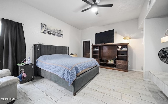 bedroom with visible vents, vaulted ceiling, and a ceiling fan