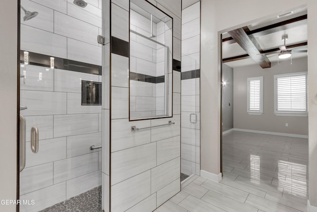 bathroom featuring visible vents, a ceiling fan, baseboards, a shower stall, and beam ceiling