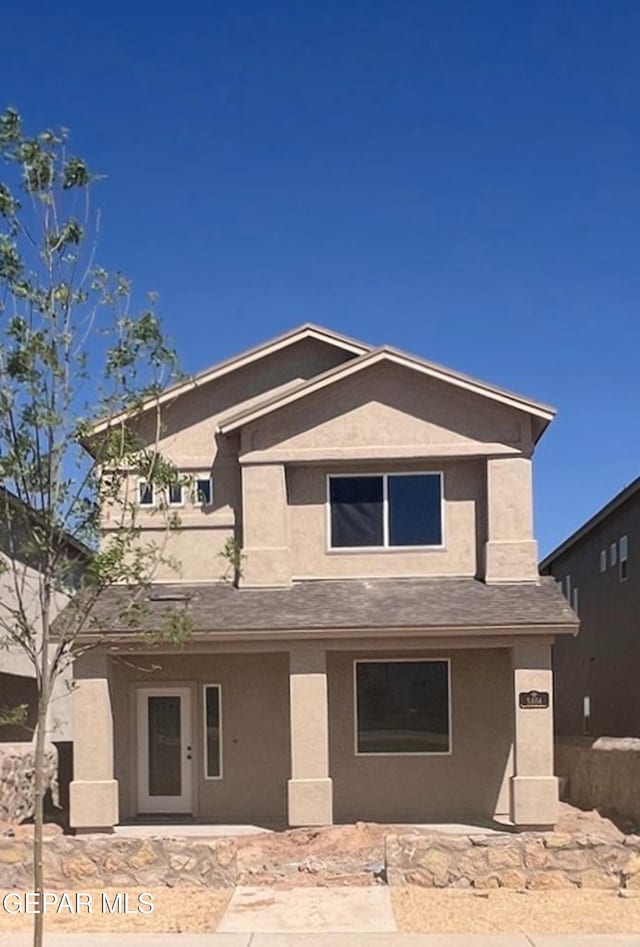 view of front of house featuring stucco siding