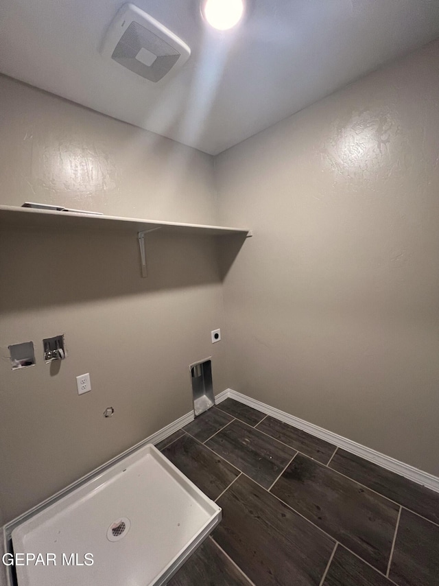 washroom featuring laundry area, visible vents, baseboards, and hookup for an electric dryer