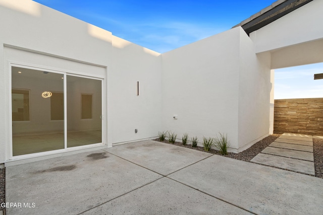 view of patio / terrace featuring fence