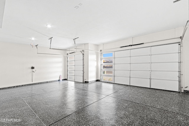 garage featuring baseboards