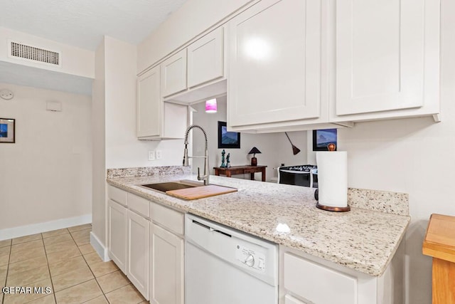 kitchen featuring a sink, visible vents, baseboards, white cabinets, and dishwasher