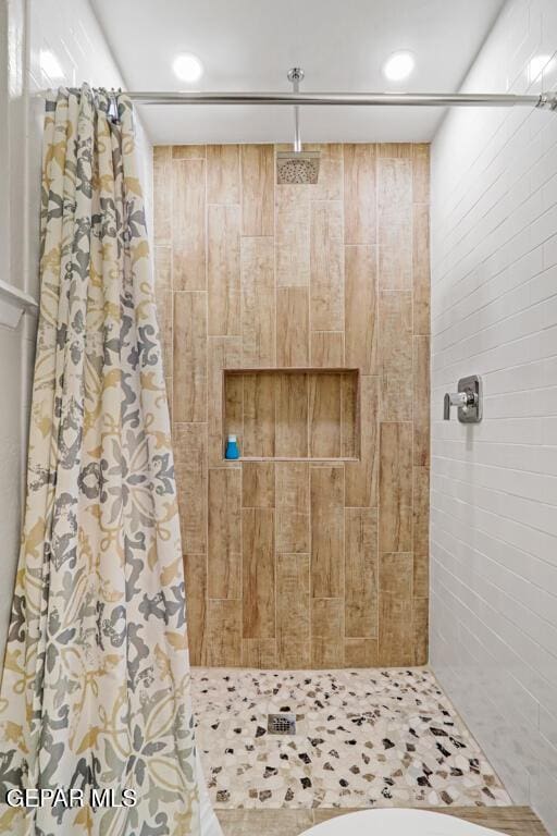 full bathroom featuring a stall shower