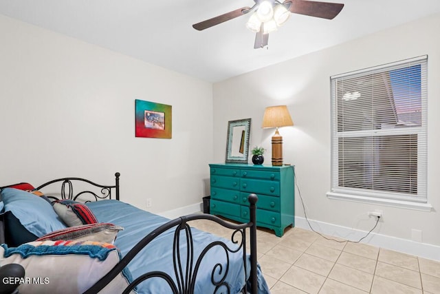 bedroom featuring baseboards, a ceiling fan, and tile patterned floors