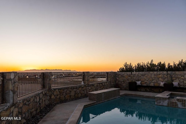 outdoor pool featuring fence