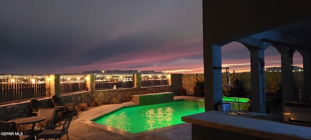 view of pool featuring a fenced backyard, a fenced in pool, and a patio