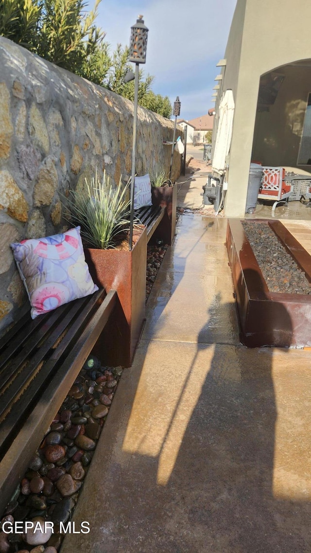 view of patio featuring fence