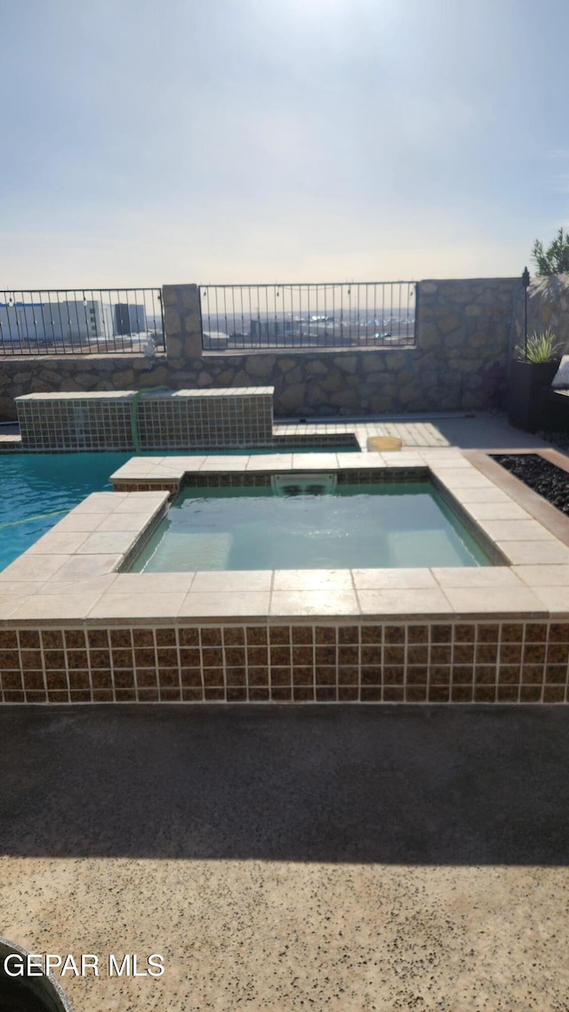 view of pool with a fenced in pool