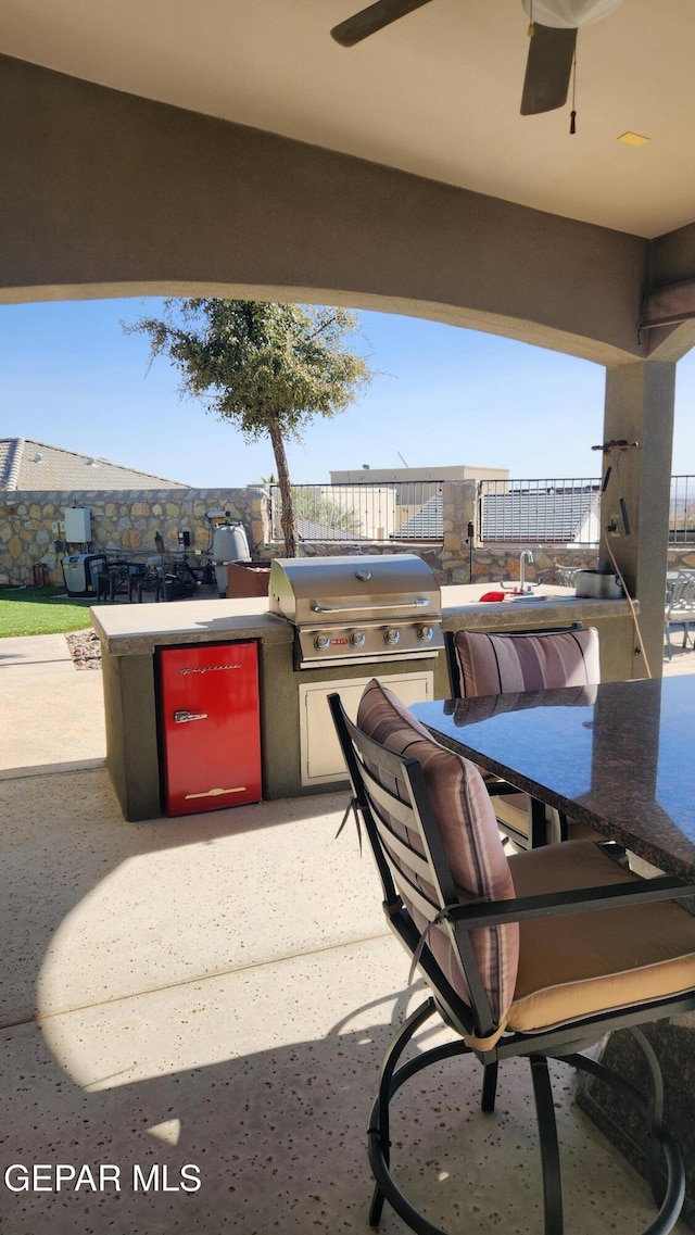 view of patio / terrace with outdoor dining space, fence, grilling area, and area for grilling