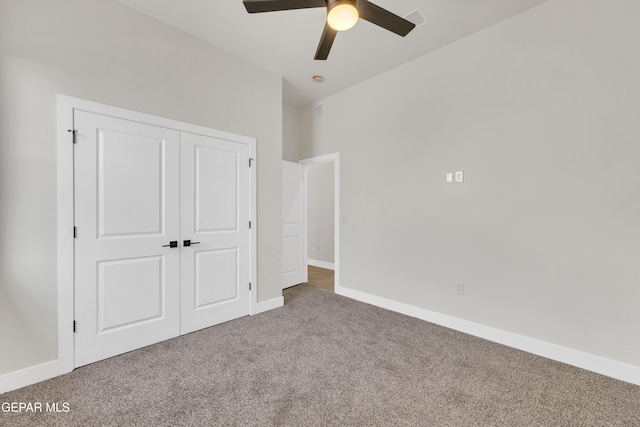 unfurnished bedroom featuring carpet floors, a closet, visible vents, and baseboards