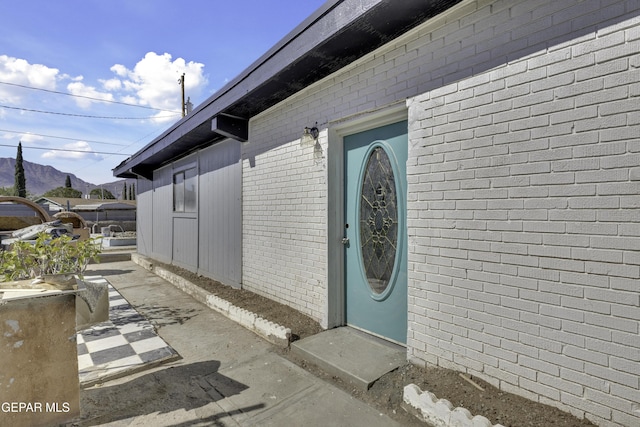 entrance to property with a mountain view