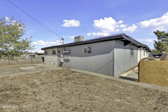 view of property exterior with fence